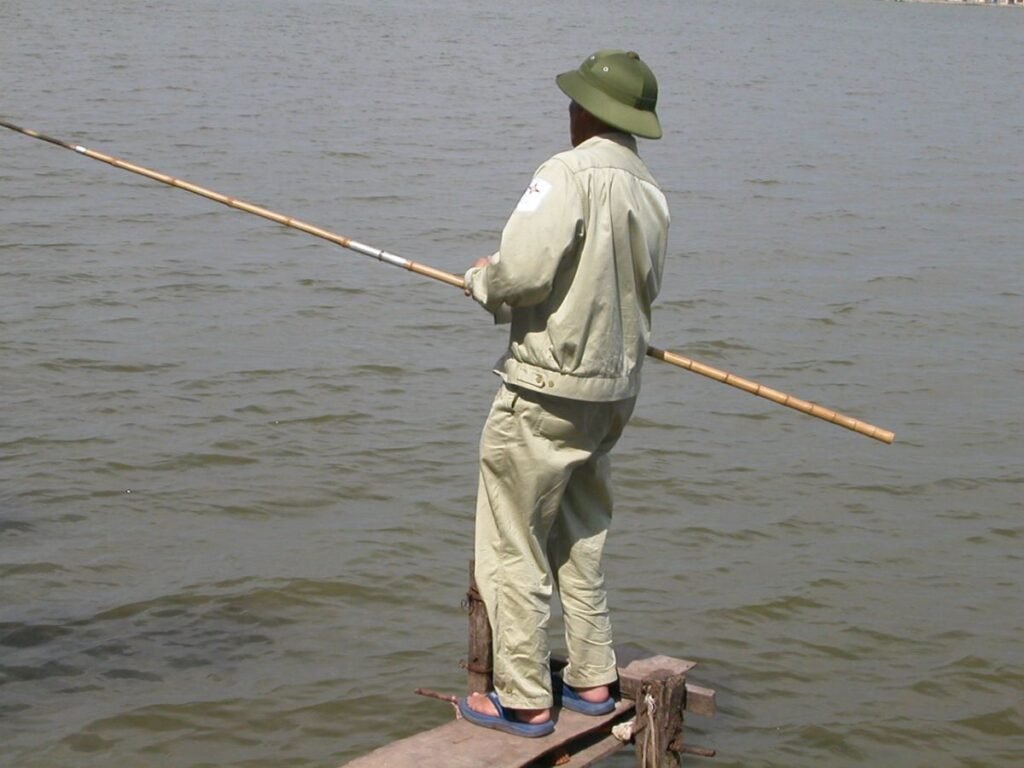 Fisherman on West Lake in Tay Ho