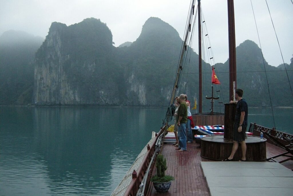 Junk boat among Ha Long karsts