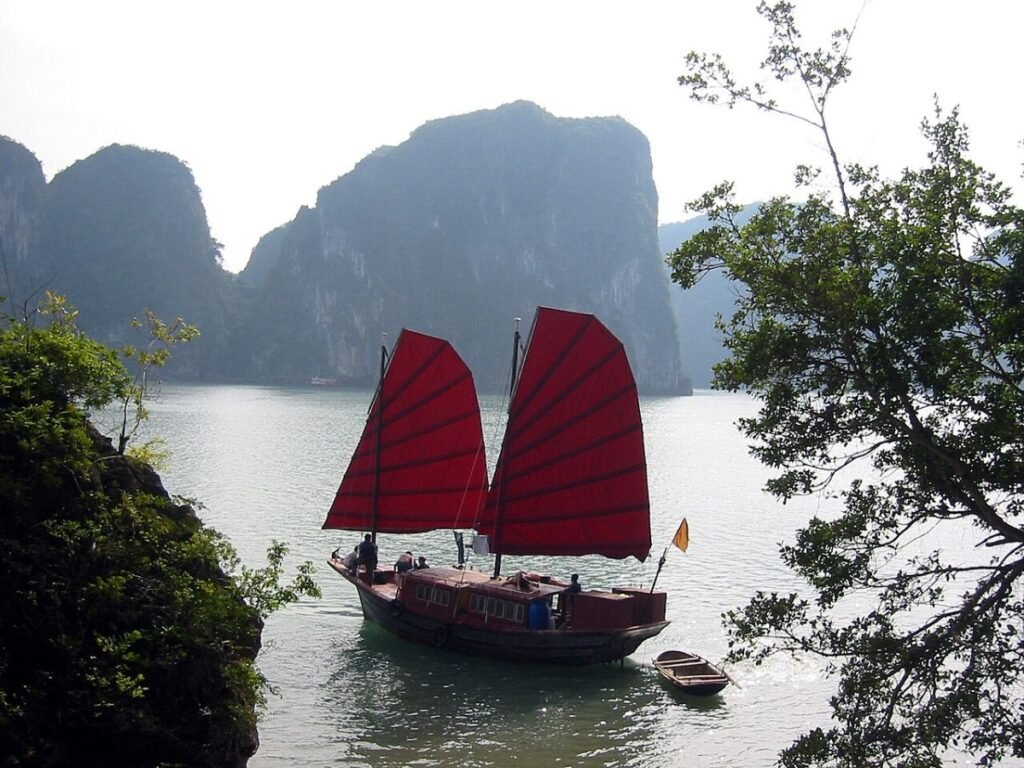 Red-sailed junk in Ha Long Bay