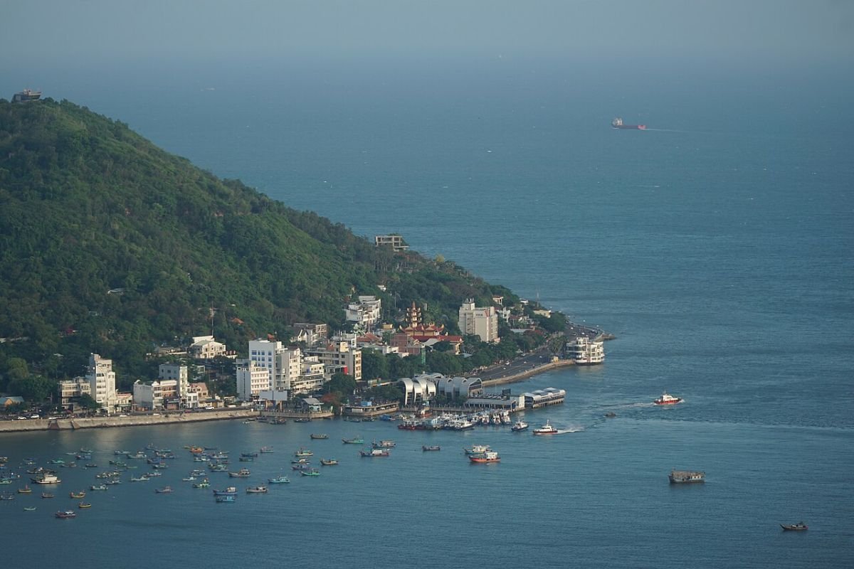 Green headland above the Vung Tau sea