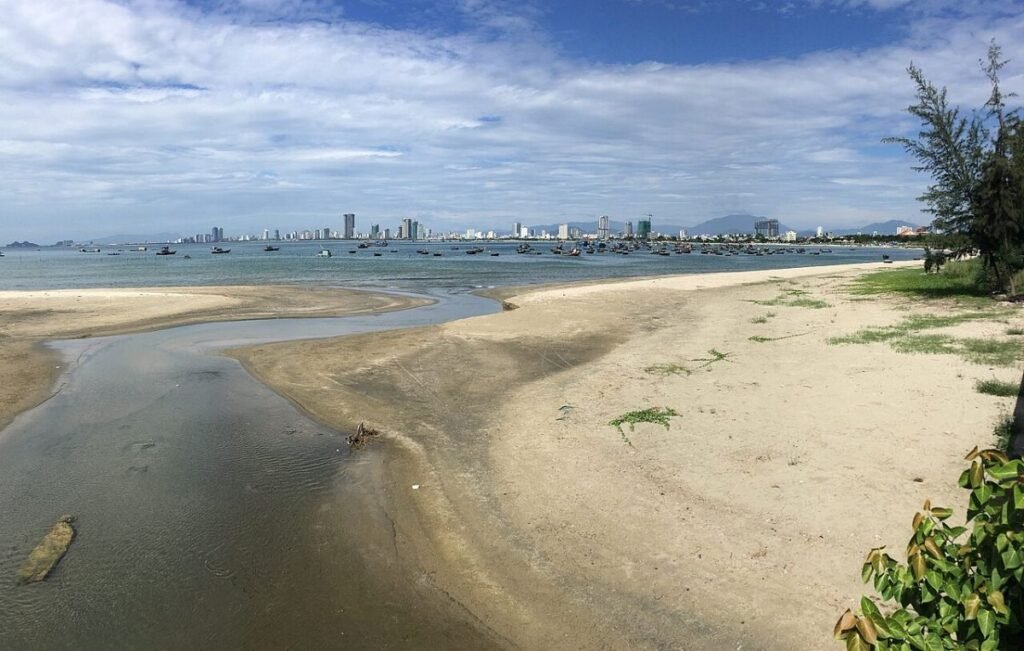 Sandy beach toward the city