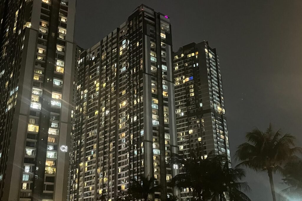 Towers around the central park at Vinhomes Central Park in the evening